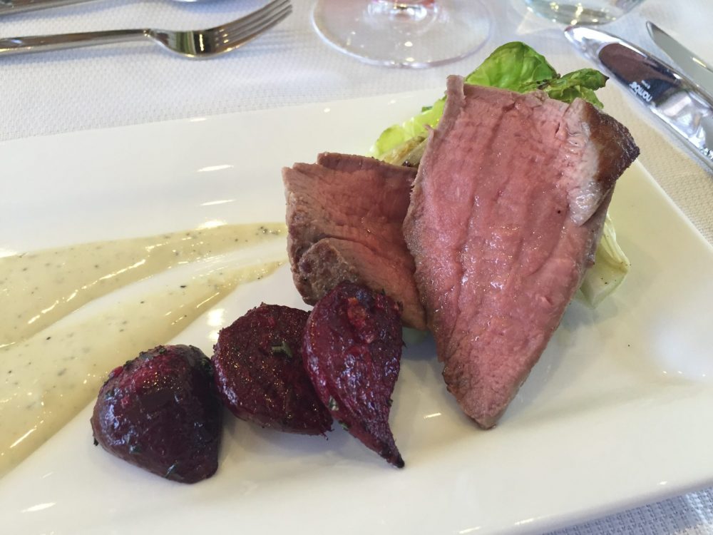 Meat dish on luxury yacht charter Freedom