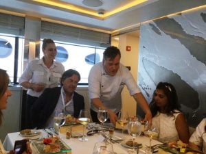 Chef Pano of Greek Motor Yacht Barents Sea serving the main course during lunch at the 2017 Greek Yacht Show in Nafplion.