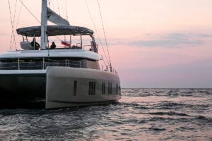 Sunreef 50 Catamaran sailing at sunset