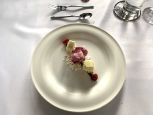 White chocolate mousse, cherry ice cream and yogurt bits.