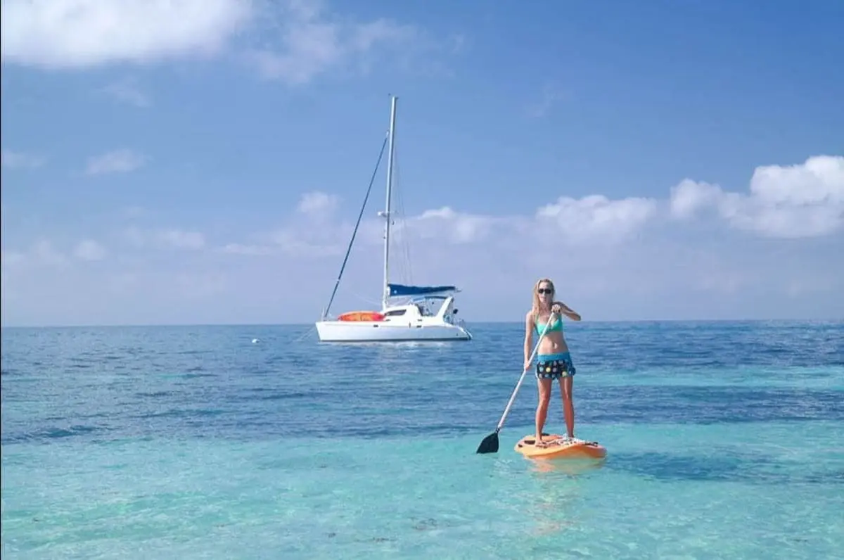 Paddleboarding on a wellness yacht charter