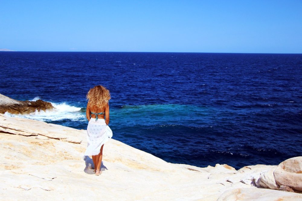 Girl on the rocks on Serifos, Greece
