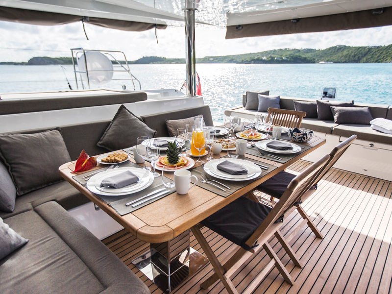 BVI Crewed Catamaran SAIL AWAY's cockpit setup for dining.