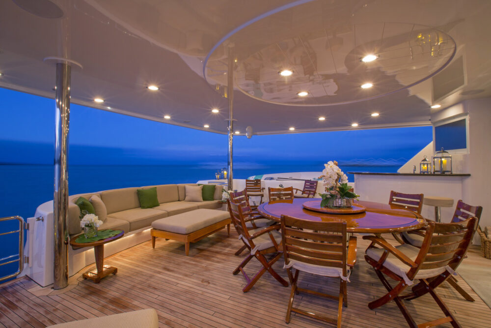 Aft deck dining onboard Motor Yacht Antares 