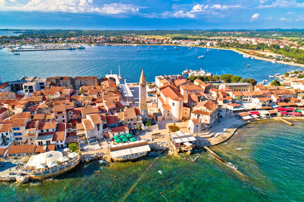 Umag town surrounded by blue and green water