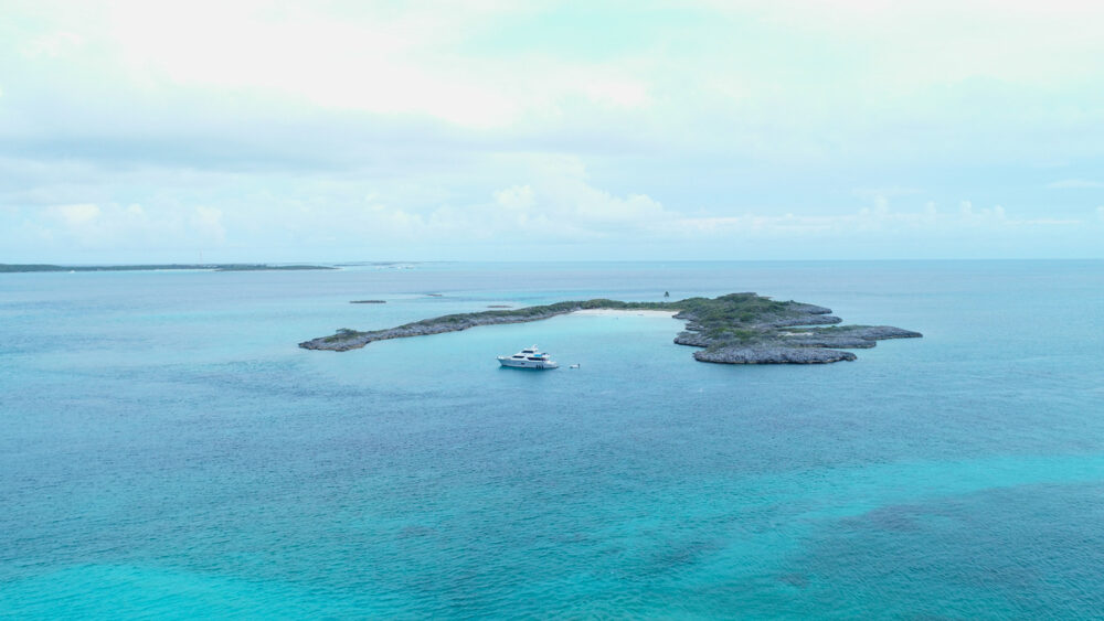 An aerial view of a yacht near the cove at Exumas, Bahamas. Like Motor Yacht Rocket One Special Rate