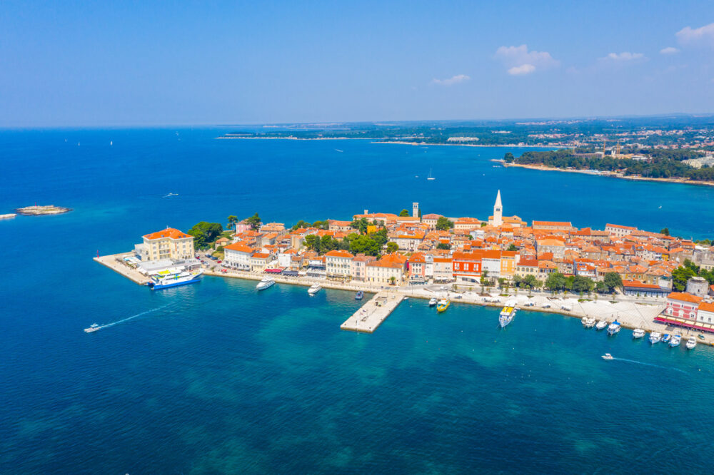 Aerial view of the Croatian town Porec surrounded by deep blue sea