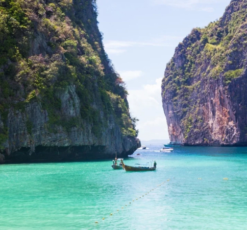 boats in clear waters in Thailand