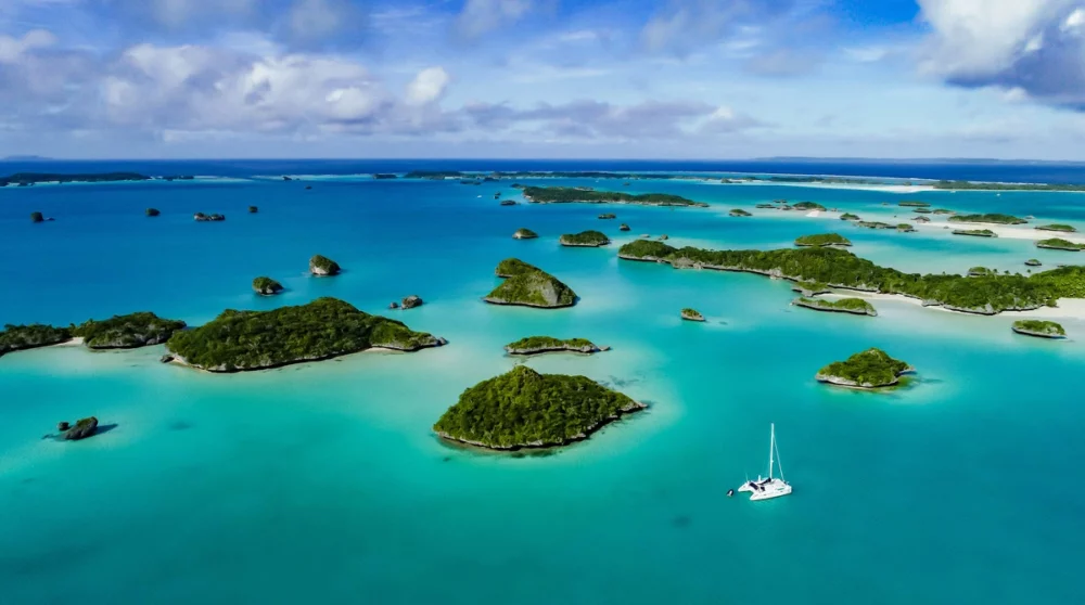 Fiji Island's clear turquoise waters and lush green coastline, ideal for private cruise charters.