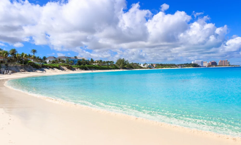 Serene beach on Paradise Island, Bahamas, perfect for private yacht vacations, offering clear blue waters and a vibrant cultural experience.