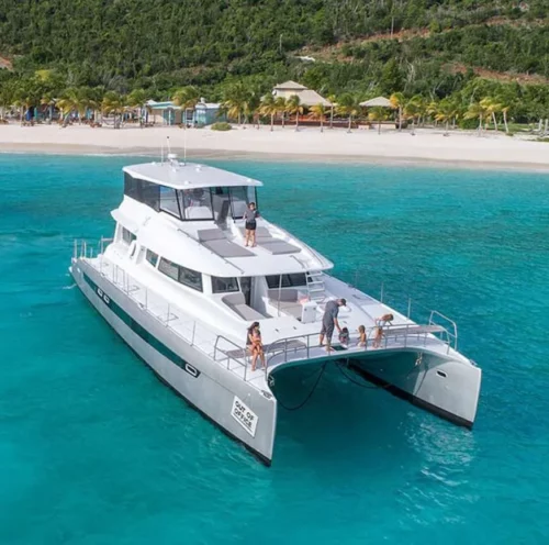 Experience luxury and adventure with our all-inclusive yacht charters aboard the Voyage 650 Power Cat. Perfect for a family getaway in stunning turquoise waters.